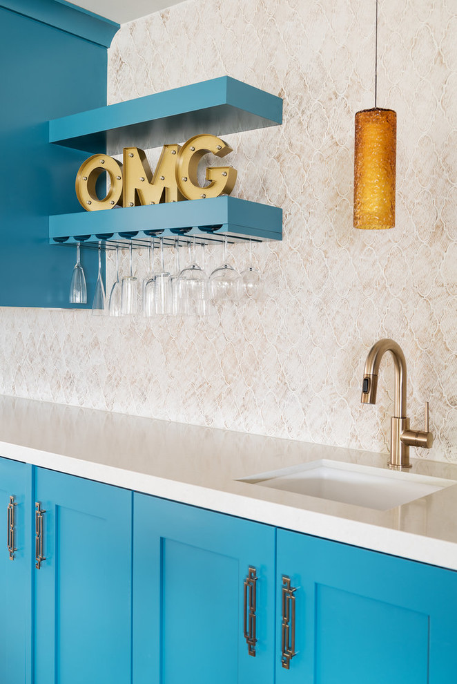 Design ideas for a transitional single-wall home bar in Salt Lake City with an undermount sink, shaker cabinets, blue cabinets, beige splashback and beige benchtop.