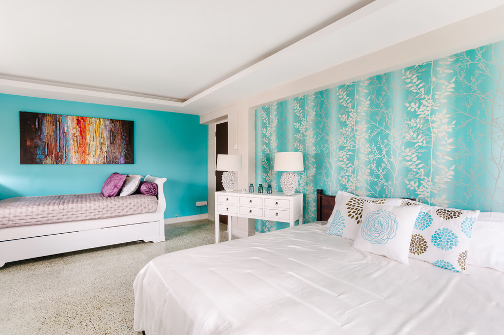 This is an example of a beach style bedroom in Singapore with blue walls.
