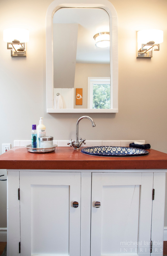 This is an example of a country bathroom in Toronto with a drop-in sink, shaker cabinets, white cabinets, concrete benchtops, a drop-in tub, a shower/bathtub combo and stone tile.