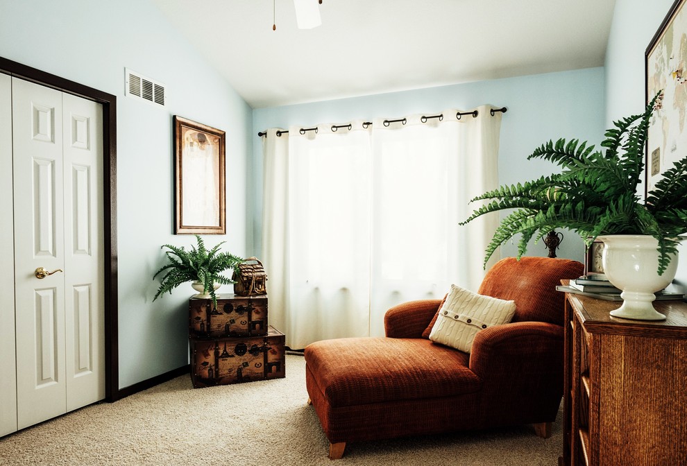 This is an example of a mid-sized transitional hallway in Other with blue walls and carpet.