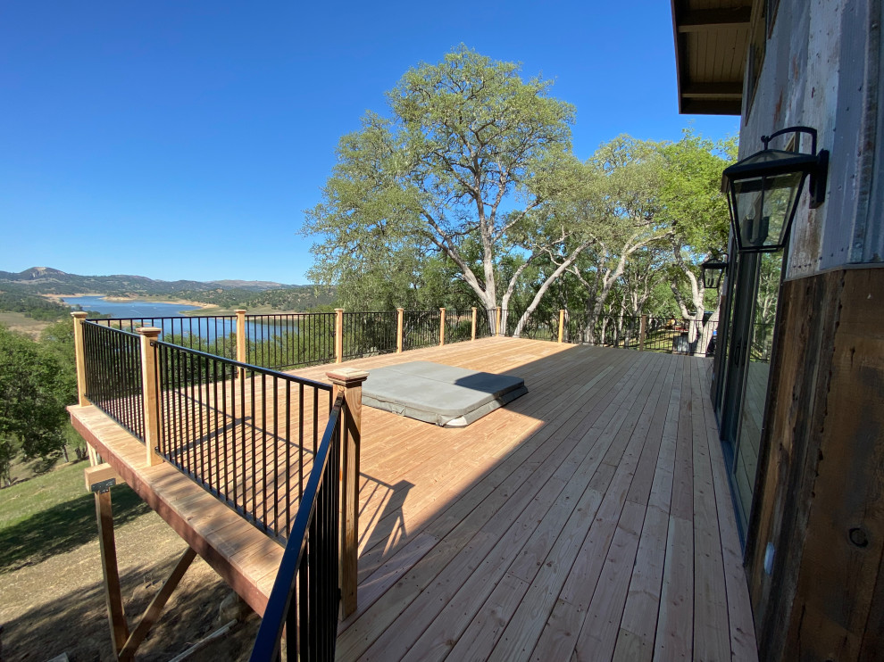Deck - mid-sized rustic backyard ground level mixed material railing deck idea in San Luis Obispo with no cover