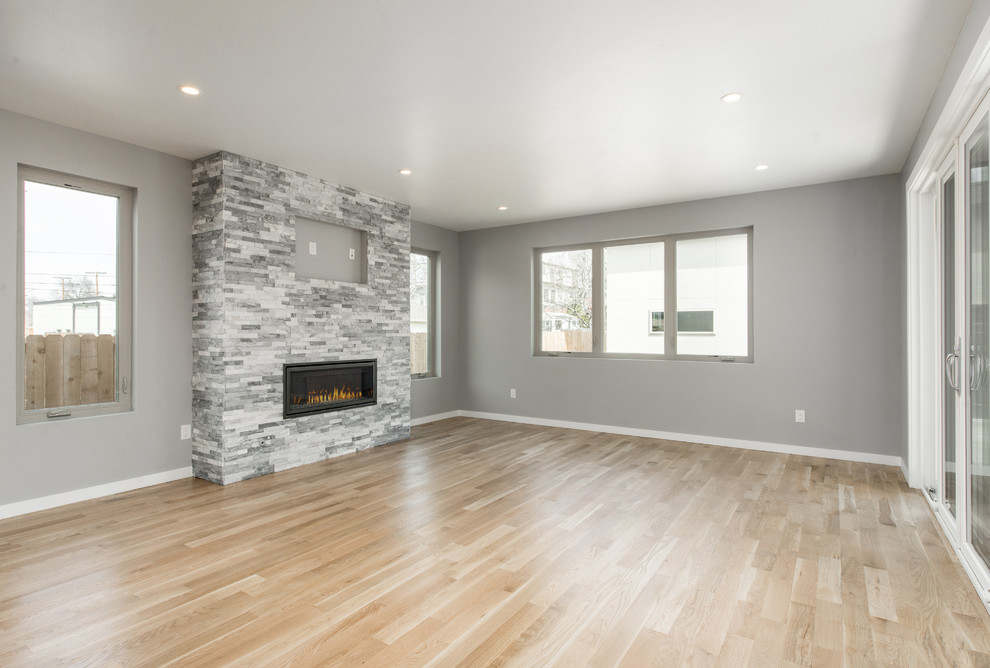 Example of a transitional home design design in Denver
