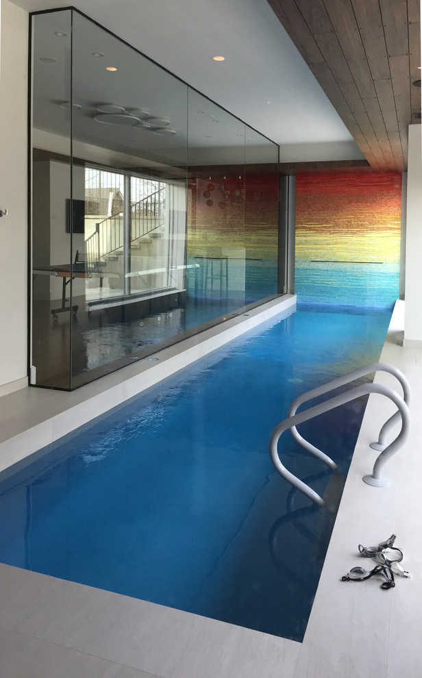 Photo of a small midcentury indoor rectangular lap pool in Toronto.