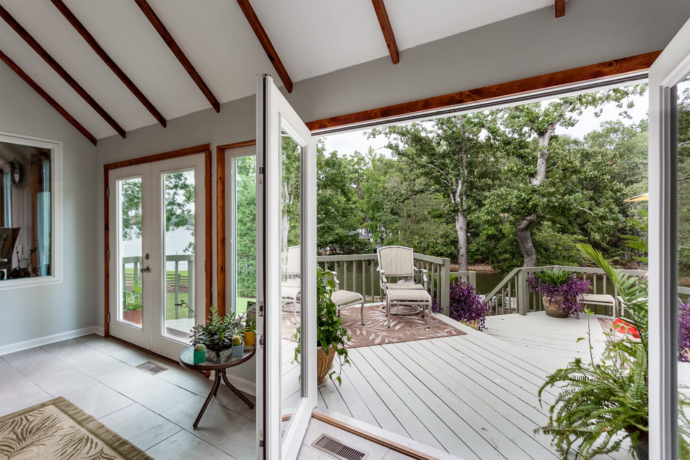 Photo of a midcentury sunroom in Charlotte.