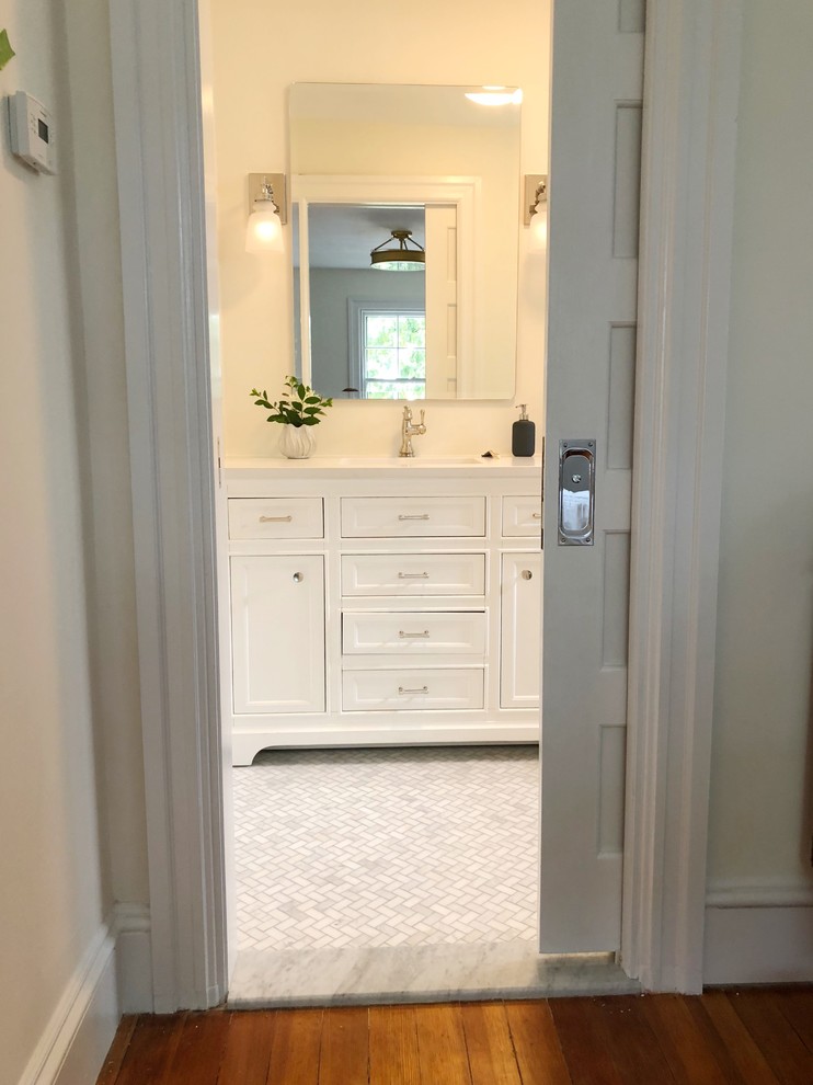 Example of a small transitional master gray tile and marble tile marble floor and gray floor alcove shower design in Providence with furniture-like cabinets, white cabinets, white walls, an undermount sink, marble countertops and white countertops