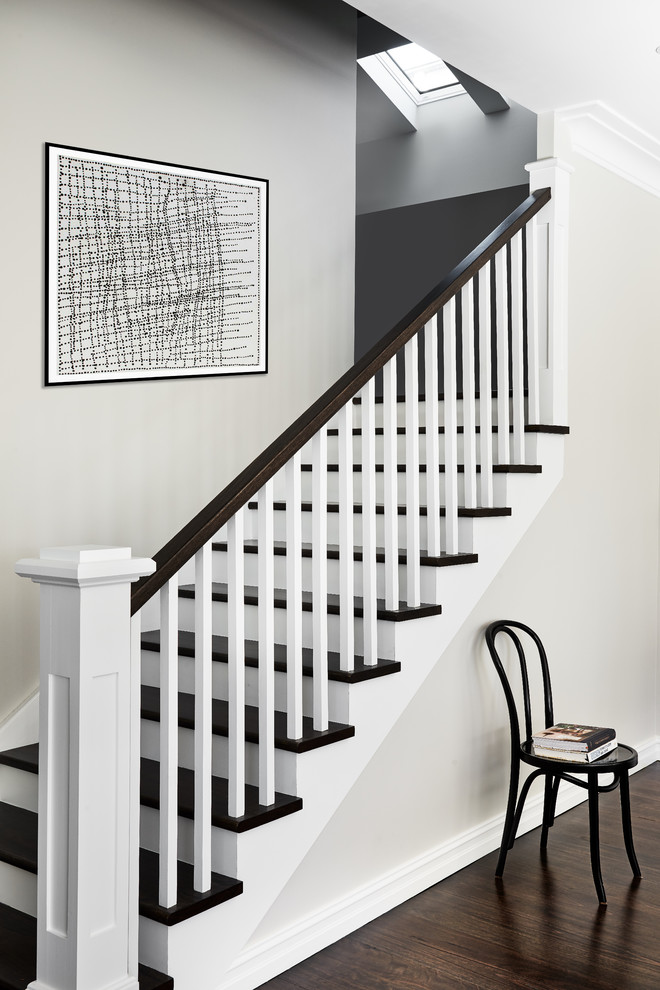 Photo of a transitional wood staircase in Sydney with painted wood risers and wood railing.