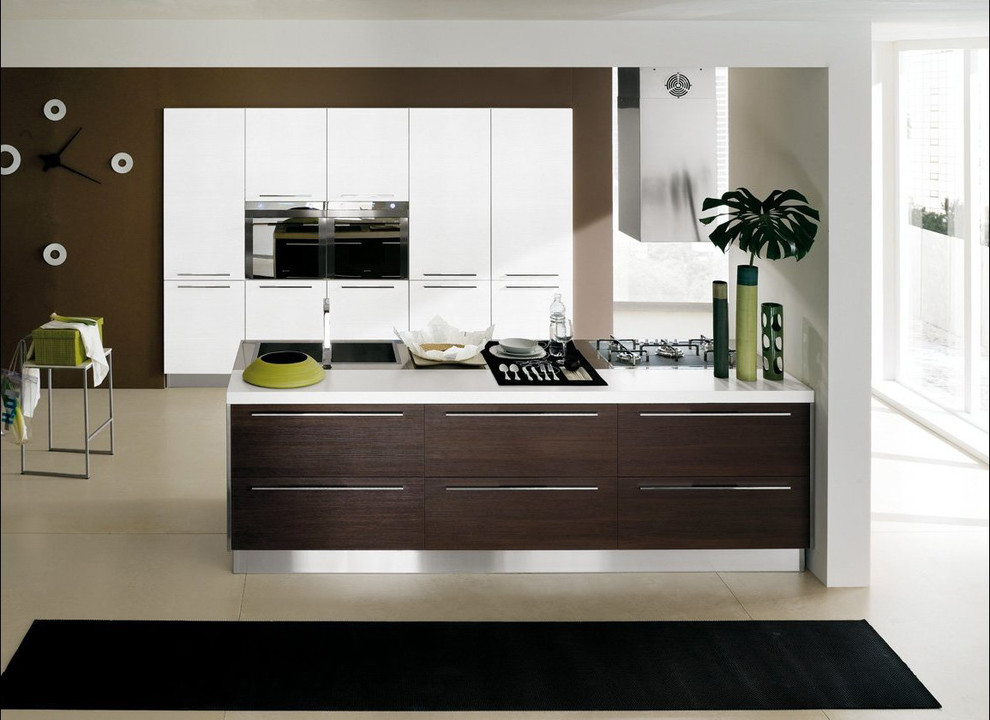 Photo of a large modern kitchen in Miami with a drop-in sink, flat-panel cabinets, dark wood cabinets, stainless steel benchtops, stainless steel appliances, with island and beige floor.