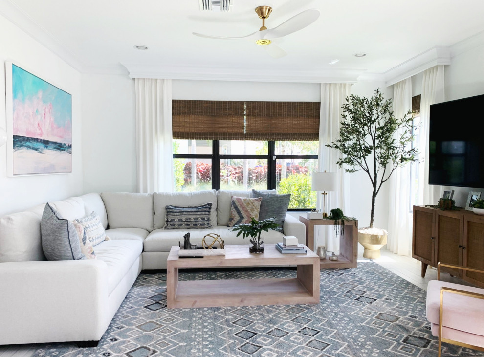 Small beach style open concept family room in Miami with white walls, porcelain floors, a wall-mounted tv and grey floor.