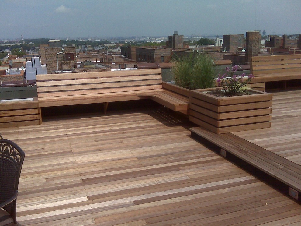 Design ideas for a large eclectic rooftop deck in New York with a container garden and no cover.