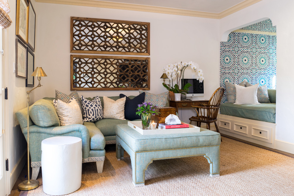 Photo of a mediterranean family room in San Francisco with white walls, no fireplace and carpet.