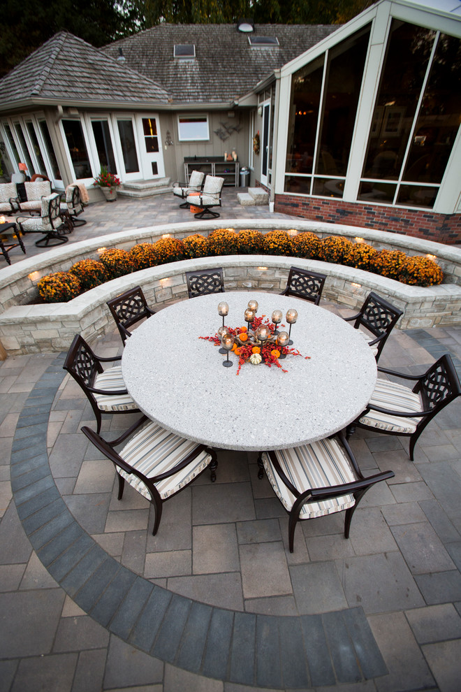 Inspiration for a transitional backyard stone water fountain landscape in Omaha.