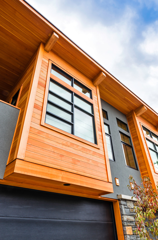 Example of a mountain style home design design in Vancouver