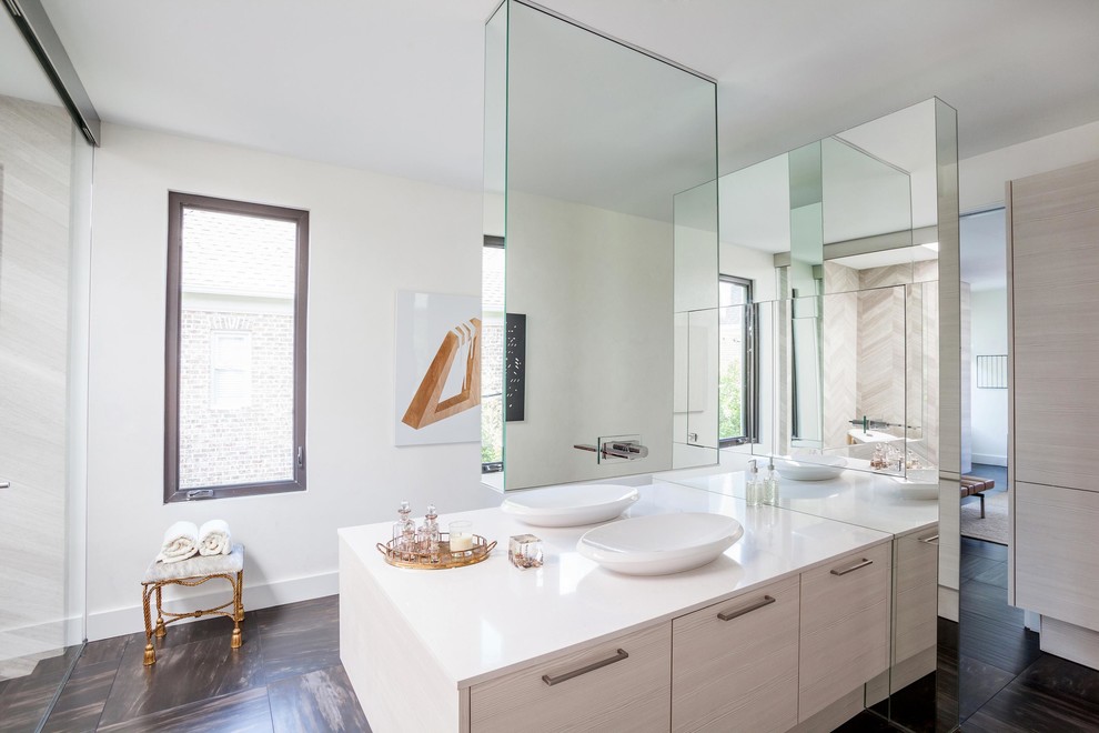 Design ideas for a large contemporary master bathroom in Houston with a vessel sink, flat-panel cabinets, light wood cabinets, engineered quartz benchtops, a freestanding tub, black tile, porcelain tile, white walls, porcelain floors and brown floor.