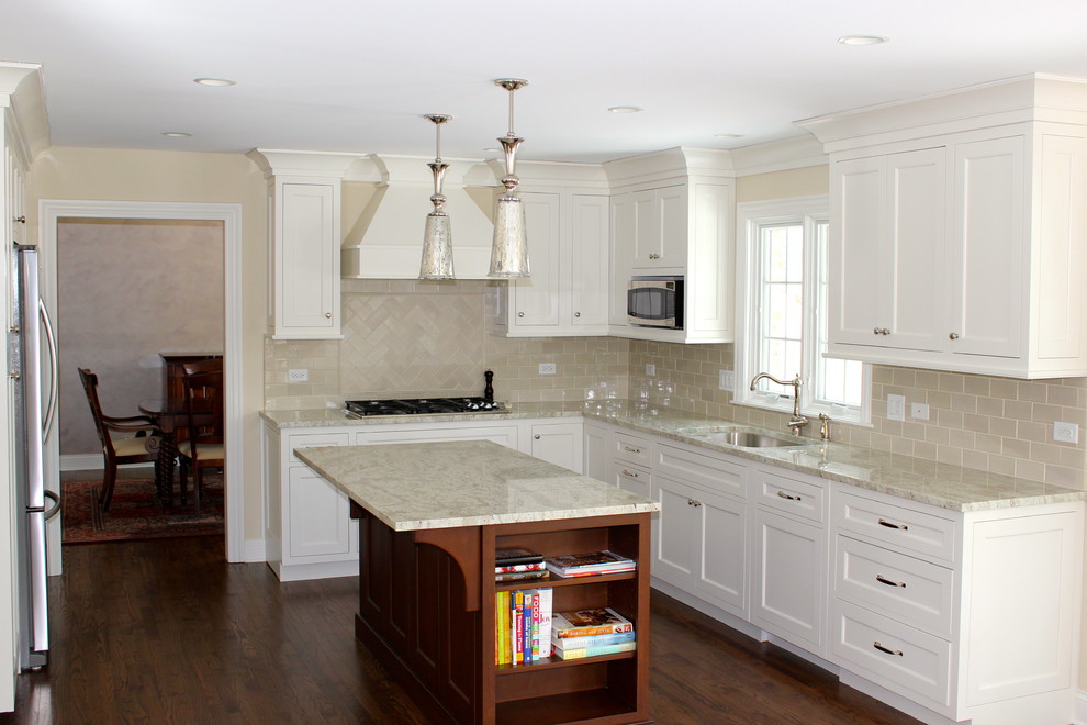 Eat-in kitchen - mid-sized transitional u-shaped dark wood floor and brown floor eat-in kitchen idea in Chicago with beige cabinets, granite countertops, beige backsplash, ceramic backsplash, stainless steel appliances, beige walls, an undermount sink, recessed-panel cabinets, an island and beige countertops