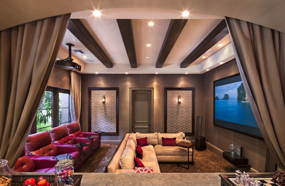 Mid-sized transitional open concept home theatre with multi-coloured walls, concrete floors and a projector screen.