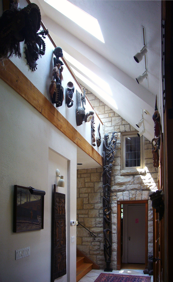 Mid-sized mountain style ceramic tile hallway photo with white walls