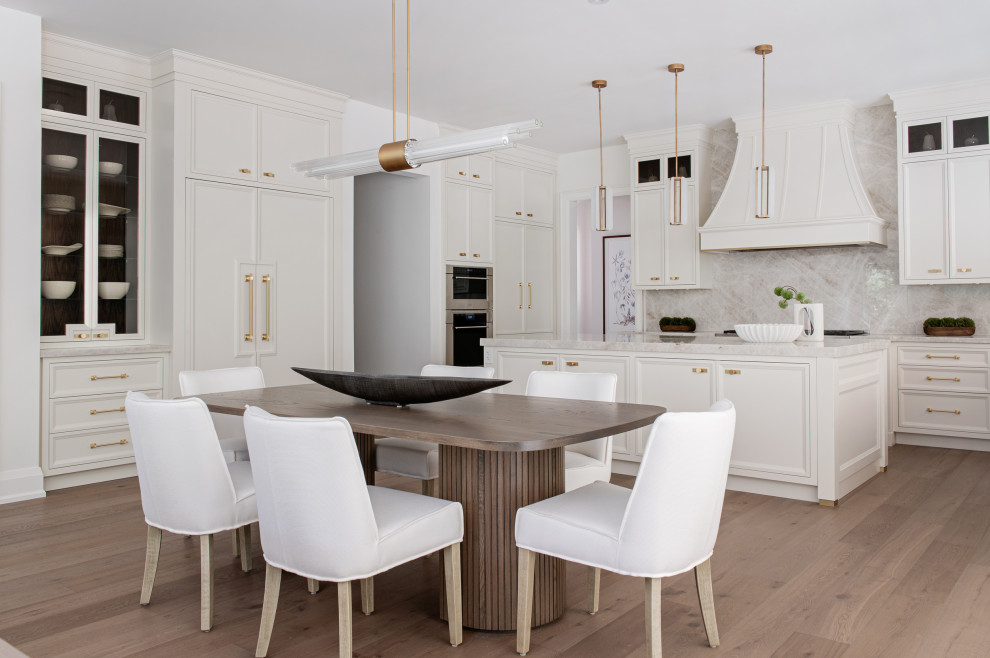 Inspiration for a large transitional light wood floor open concept kitchen remodel in Toronto with recessed-panel cabinets, white cabinets, quartz countertops, multicolored backsplash, quartz backsplash, paneled appliances, an island and multicolored countertops