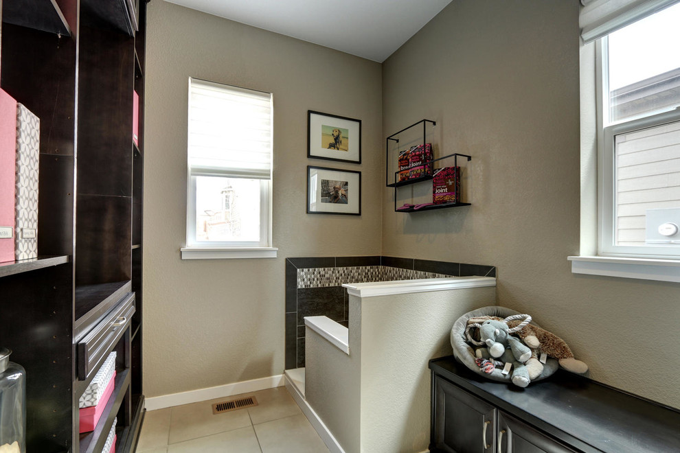 Mid-sized transitional galley ceramic tile dedicated laundry room photo in Denver with flat-panel cabinets, dark wood cabinets, wood countertops, beige walls and a side-by-side washer/dryer