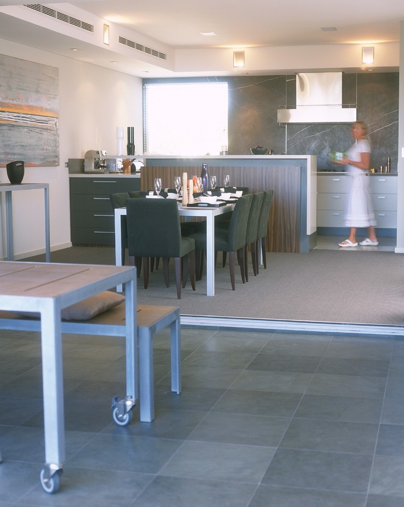 Photo of a large contemporary kitchen/dining combo in Perth with travertine floors, white walls and no fireplace.