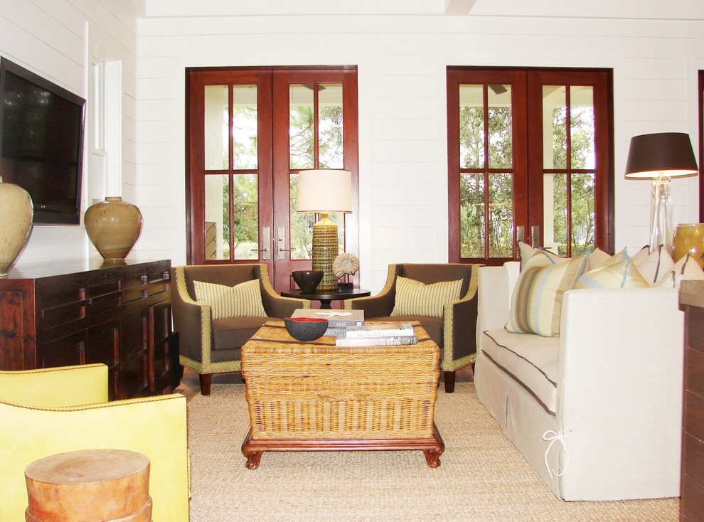 This is an example of a traditional living room in Atlanta with a wall-mounted tv.