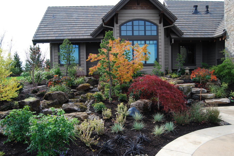 This is an example of a traditional garden in Portland with a water feature.