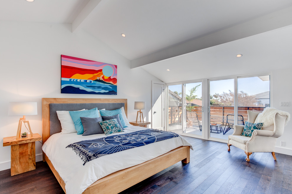 Large contemporary master bedroom in Los Angeles with white walls, no fireplace and dark hardwood floors.