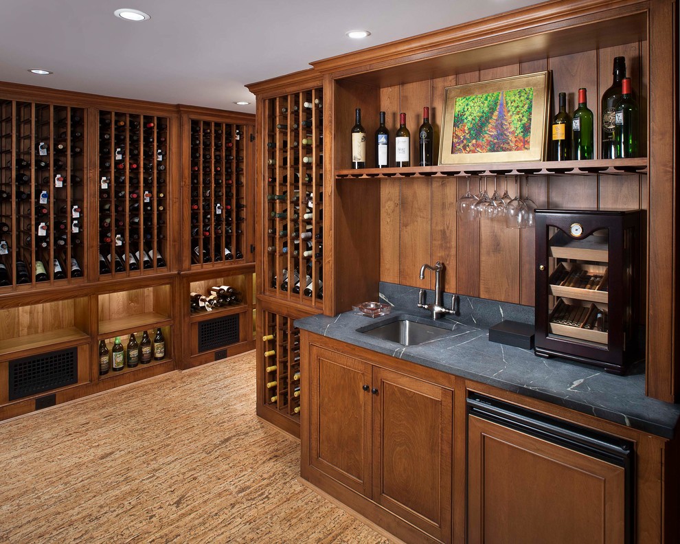 Inspiration for a traditional wine cellar in Wilmington with cork floors and storage racks.