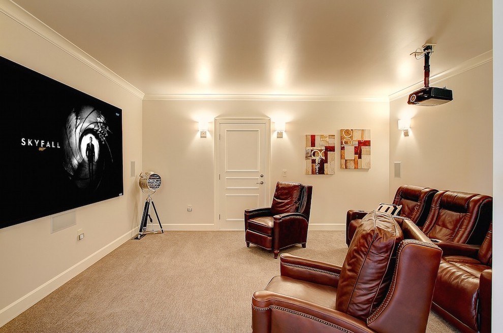 This is an example of a country enclosed home theatre in Seattle with carpet, white walls and a projector screen.