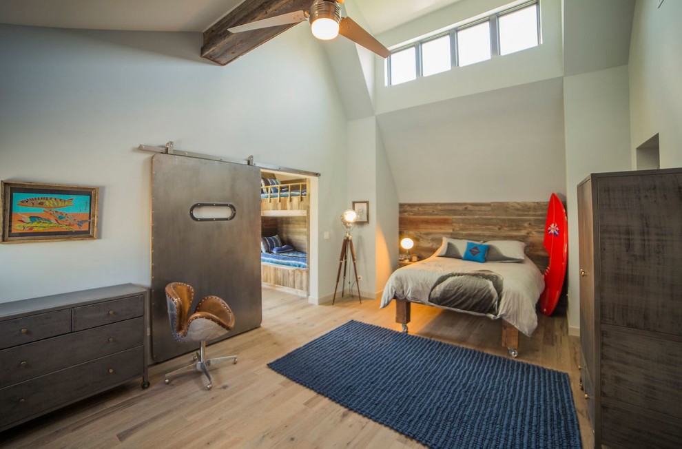 Inspiration for a large transitional guest light wood floor bedroom remodel in Chicago with blue walls and no fireplace