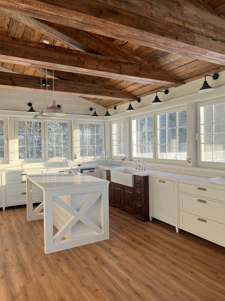 This is an example of a large country kitchen in Other.