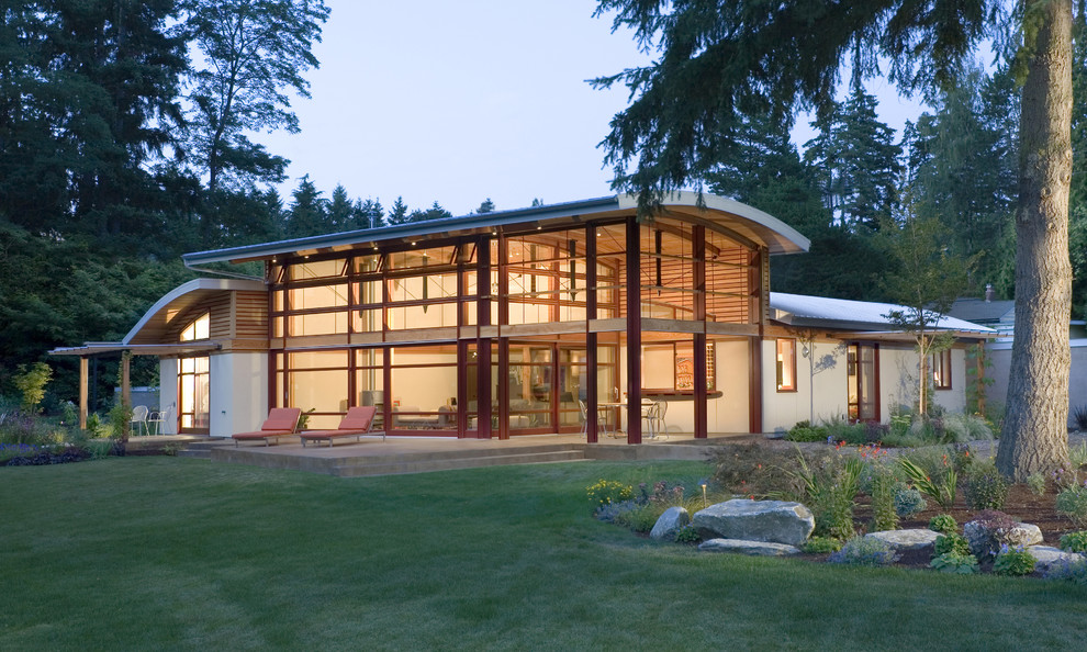 Mid-sized contemporary one-storey white exterior in Seattle with mixed siding.