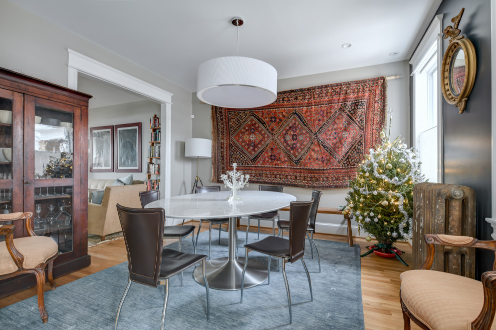 Example of a mid-sized transitional medium tone wood floor kitchen/dining room combo design with blue walls