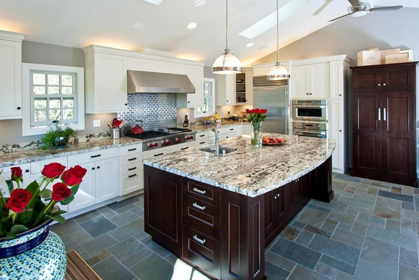 This is an example of a large traditional u-shaped eat-in kitchen in San Francisco with an undermount sink, shaker cabinets, white cabinets, granite benchtops, metallic splashback, metal splashback, stainless steel appliances, slate floors and with island.