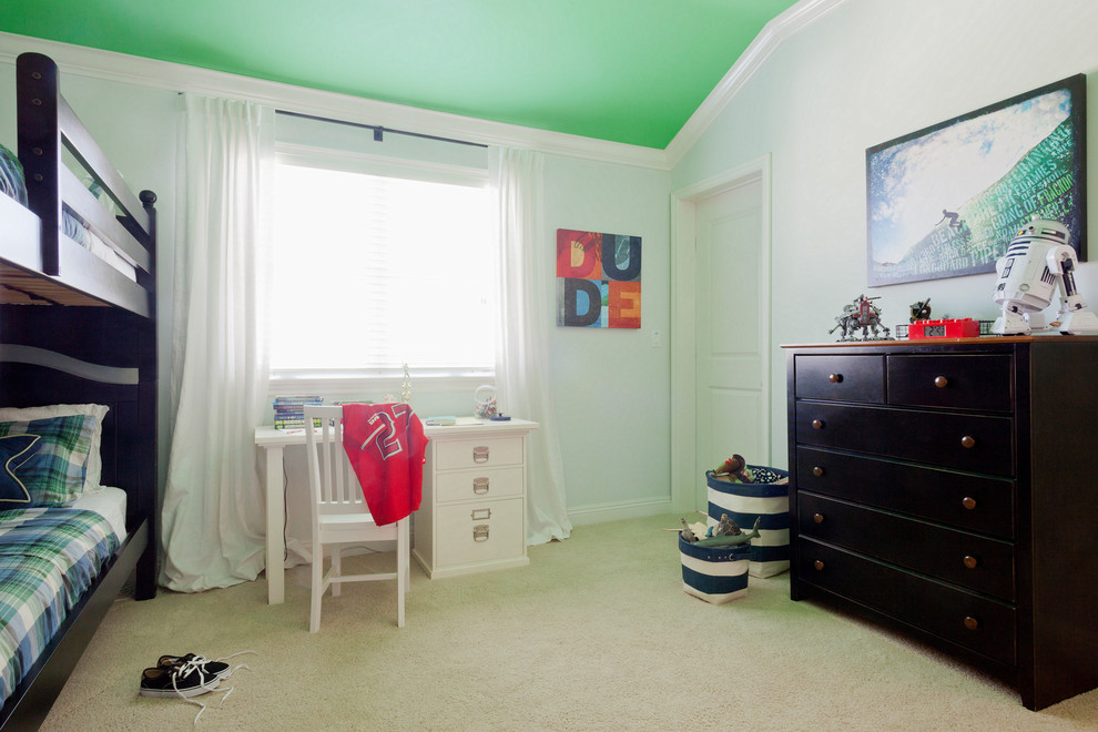 Photo of a mid-sized traditional kids' bedroom for kids 4-10 years old and boys in Los Angeles with blue walls and carpet.