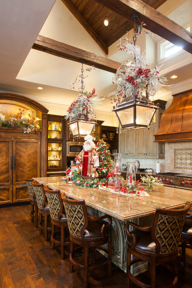Inspiration for a traditional kitchen in Houston with recessed-panel cabinets, dark wood cabinets, panelled appliances, dark hardwood floors and with island.