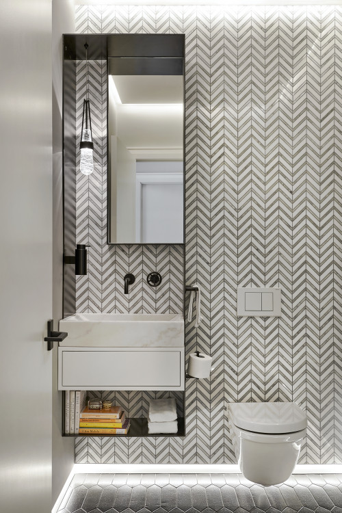 A Modern Powder Room Featuring Chevron-Patterned Wall Tiles