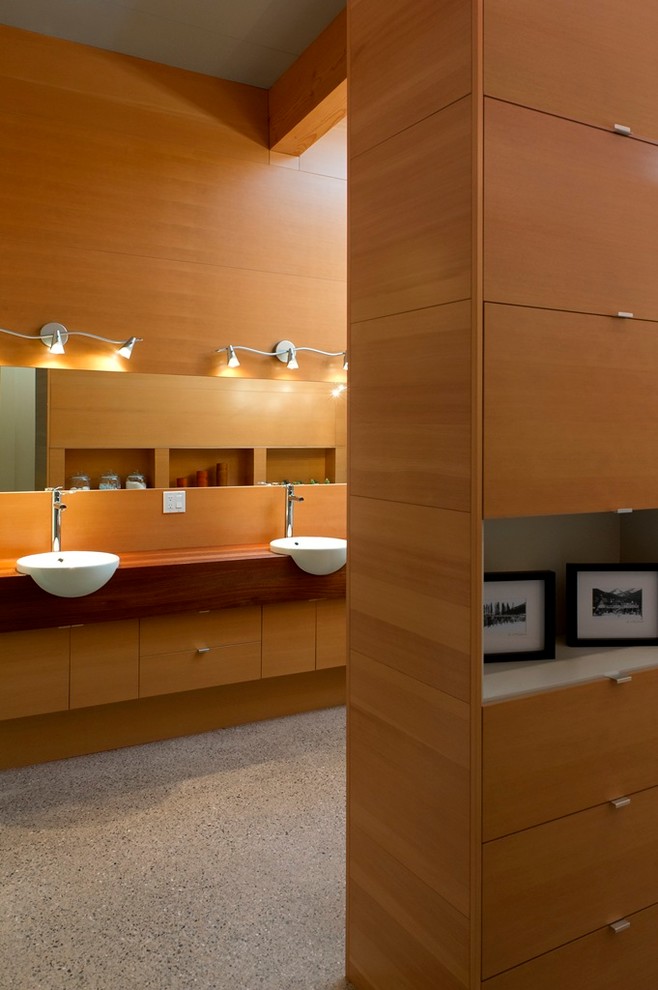 Design ideas for a contemporary bathroom in Calgary with wood benchtops.