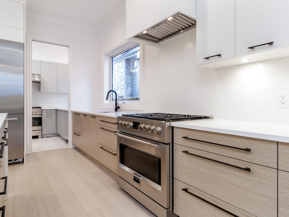 Example of a transitional kitchen design in Vancouver