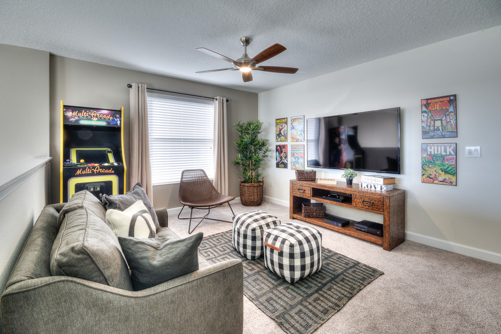 Mid-sized traditional enclosed family room in Orlando with grey walls, carpet, no fireplace, a wall-mounted tv, a game room and grey floor.