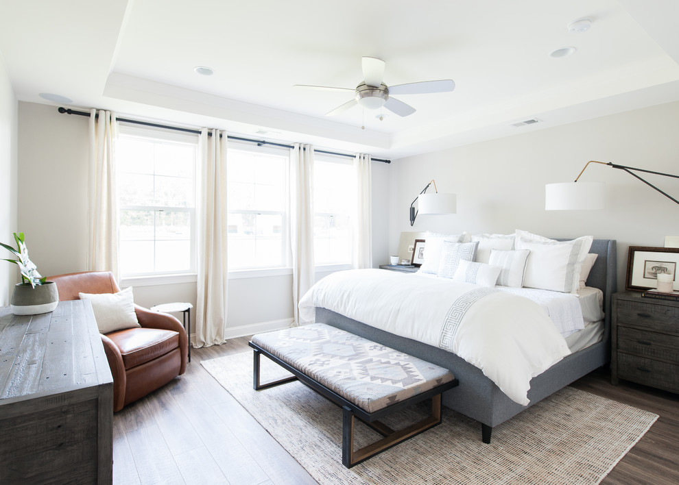 Design ideas for a transitional master bedroom in Charleston.