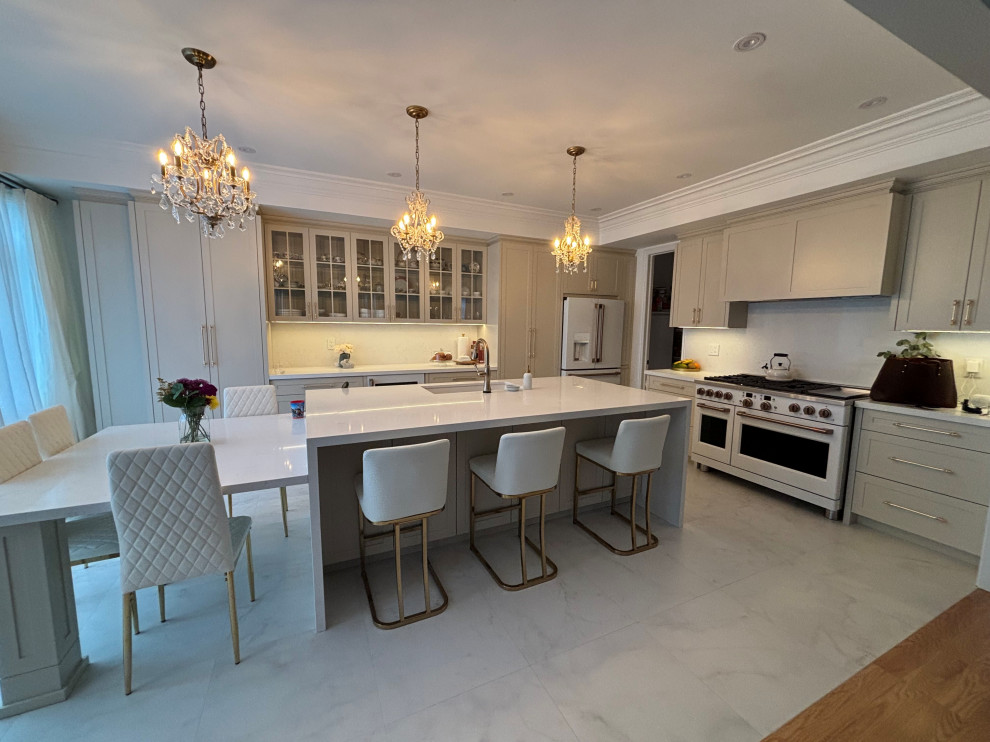 Example of a mid-sized transitional l-shaped porcelain tile, white floor and coffered ceiling eat-in kitchen design in Toronto with an undermount sink, shaker cabinets, beige cabinets, quartz countertops, white backsplash, quartz backsplash, white appliances, an island and white countertops