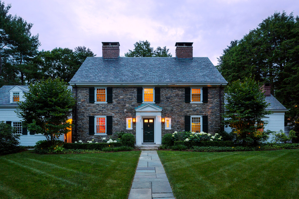 Inspiration for a mid-sized transitional two-storey brick beige house exterior in Boston with a gable roof and a shingle roof.