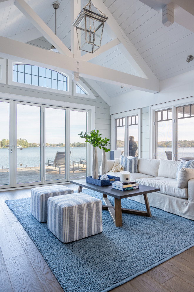 Design ideas for a nautical conservatory in Toronto with medium hardwood flooring, a standard ceiling and brown floors.