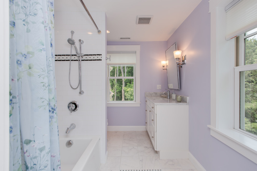 Photo of a small traditional kids bathroom in Boston with flat-panel cabinets, white cabinets, an alcove tub, a shower/bathtub combo, white tile, subway tile, purple walls, marble floors, an undermount sink, marble benchtops, white floor and a shower curtain.
