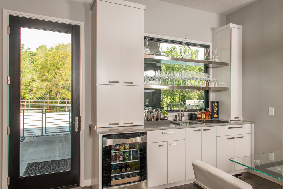 Wet bar - mid-sized contemporary single-wall wet bar idea with white cabinets
