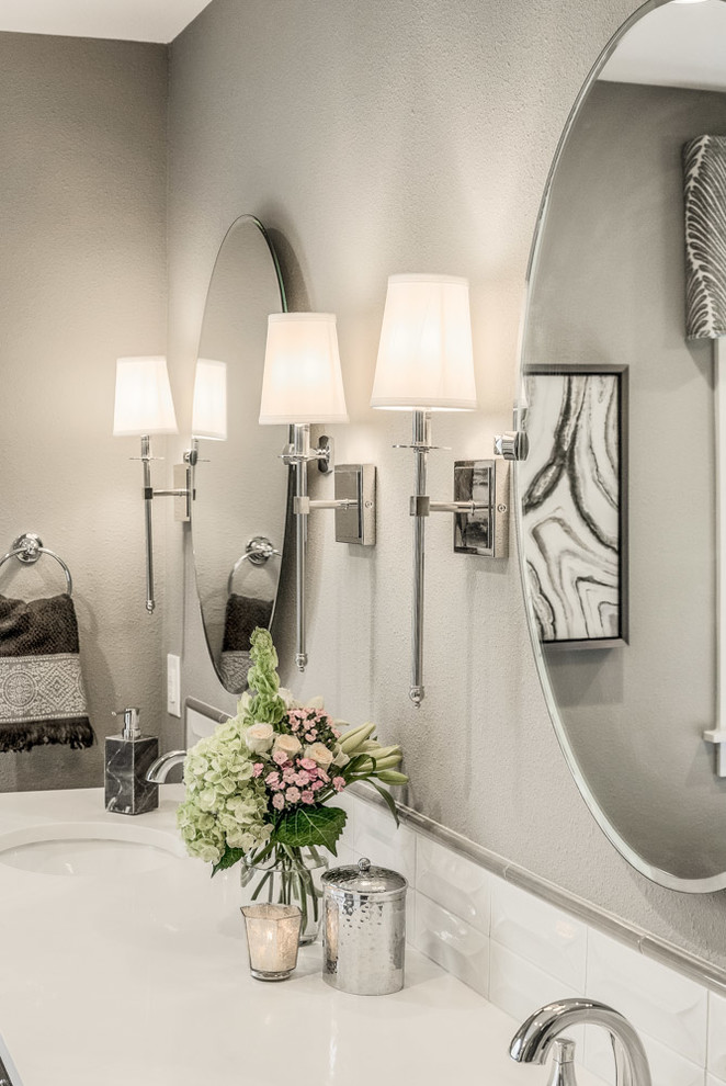 Inspiration for a mid-sized transitional master gray tile and porcelain tile ceramic tile and beige floor home design remodel with recessed-panel cabinets, dark wood cabinets, a one-piece toilet, gray walls and quartz countertops