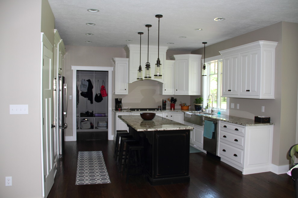 Inspiration for a mid-sized l-shaped dark wood floor eat-in kitchen remodel with a farmhouse sink, raised-panel cabinets, white cabinets, granite countertops, stainless steel appliances and an island