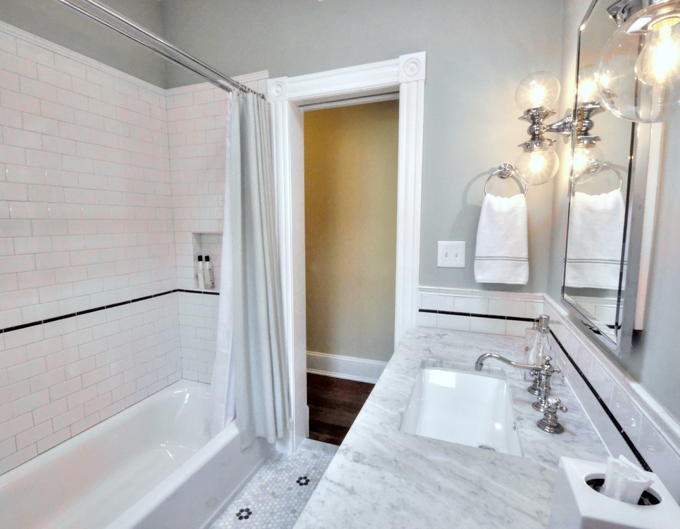Design ideas for a mid-sized traditional master bathroom in DC Metro with an undermount sink, flat-panel cabinets, white cabinets, marble benchtops, an alcove tub, a two-piece toilet, black and white tile, ceramic tile, green walls and marble floors.