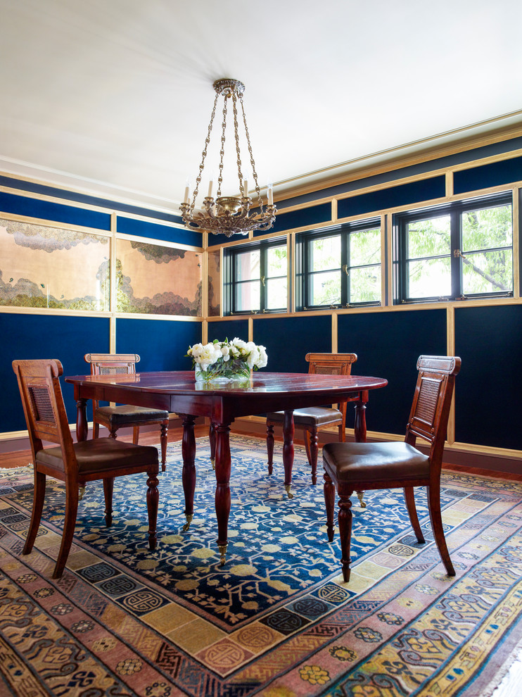 Traditional dining room in New York with blue walls.