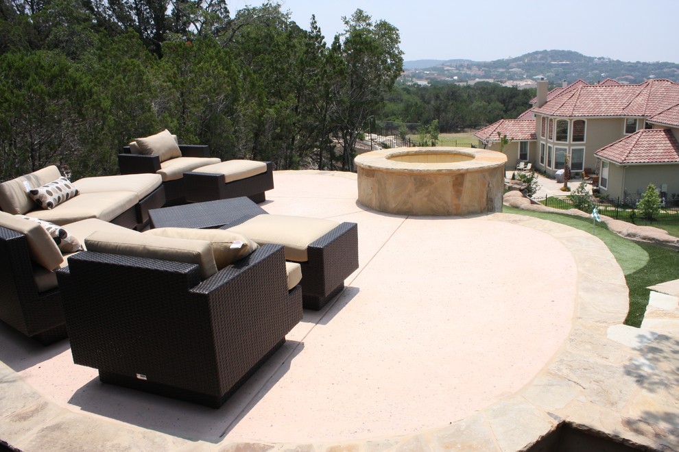 Large minimalist backyard custom-shaped natural water slide photo in Austin with decking